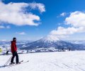 Skier,With,A,Snowy,Volcano,(niseko,,Hokkaido,,Japan)